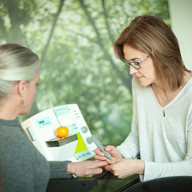 Dr Brenda McCool discusses a food sensitivity test with a patient.